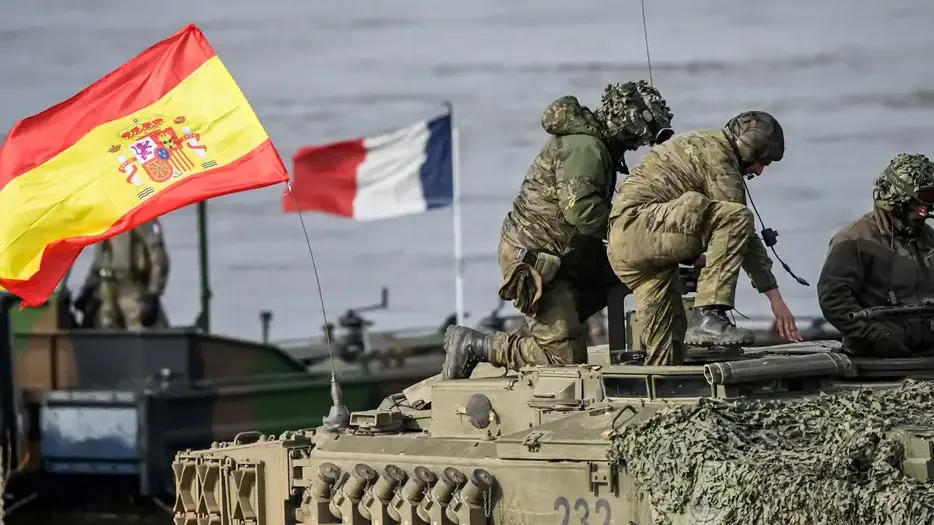 It is highly unlikely the Spanish or French flags will disappear from NATO maneuvers any time soon (File photo: March 2024)