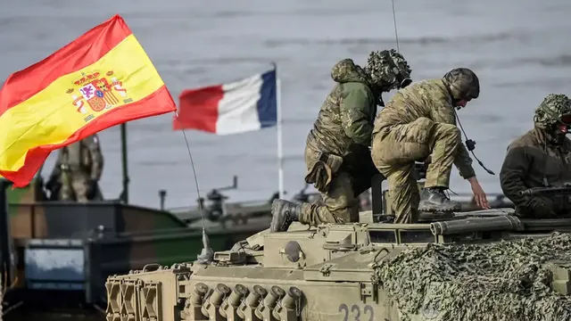 It is highly unlikely the Spanish or French flags will disappear from NATO maneuvers any time soon (File photo: March 2024)
